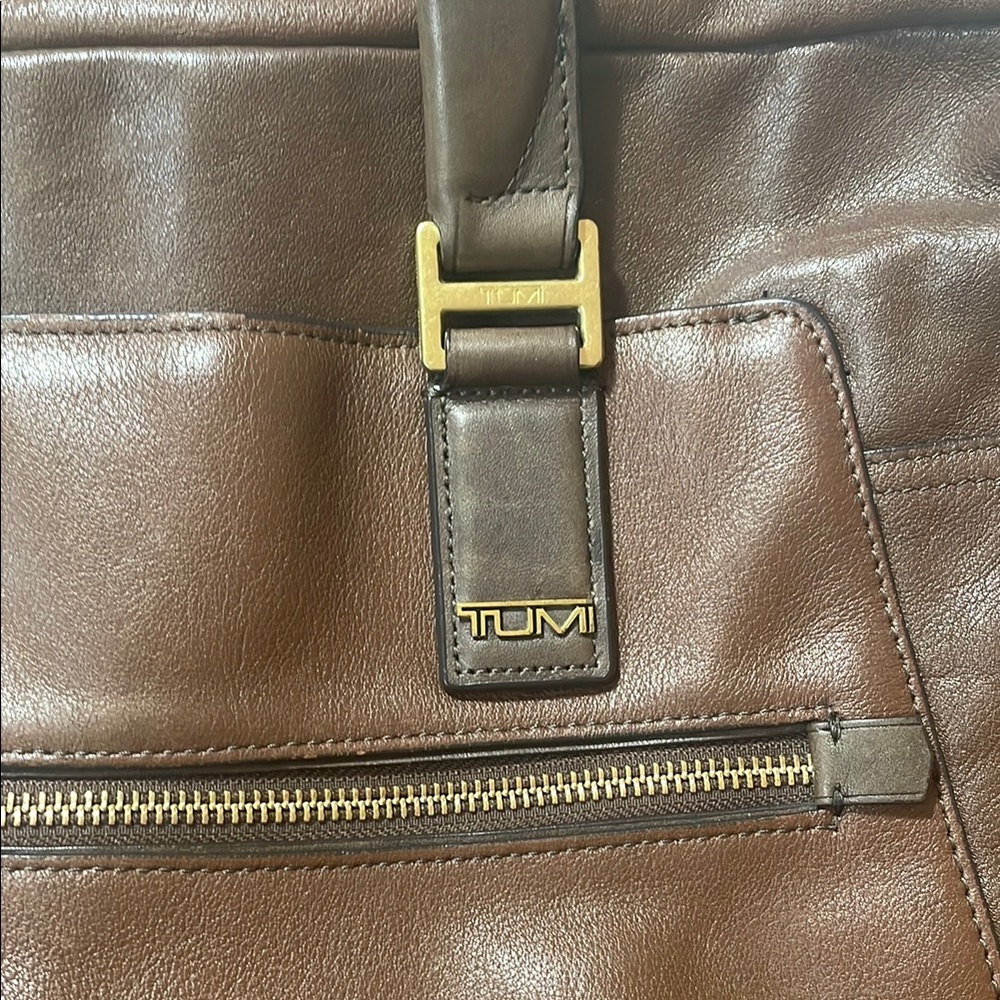 TUMI Rich Brown Leather Briefcase with Gold Accents